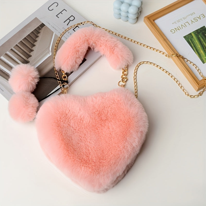 Yengil dizayndagi ajinli ayollar uchun plush yurak shaklidagi yelka sumkasi, ajratiladigan tasma va zip yopilishi bilan. Kundalik sayrlar, xaridlar va uchrashuvlar uchun mukammal. Yorqin pushti va boshqa ranglarda mavjud.