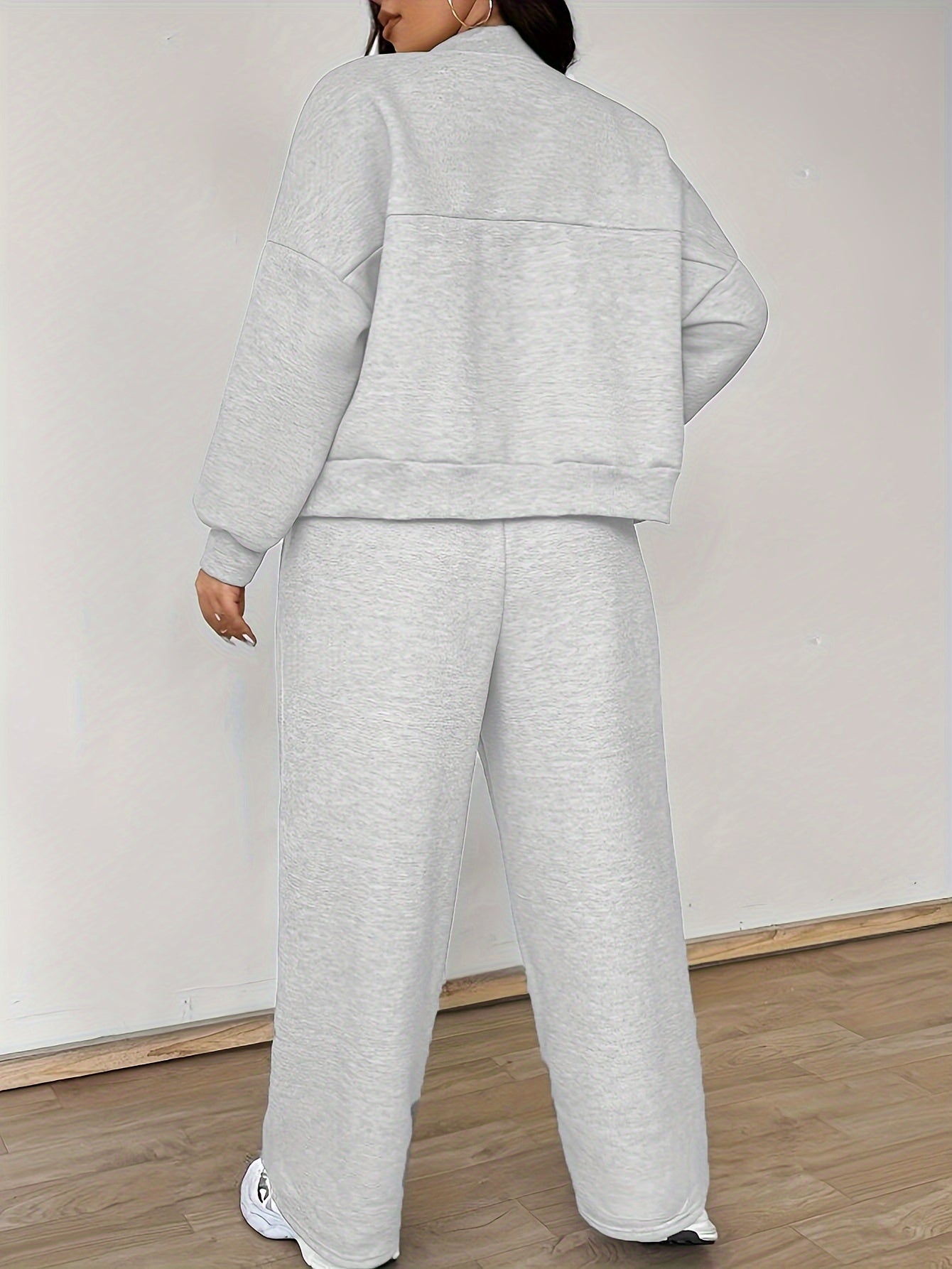 "Poliester to'qima matodan tayyorlangan, beysbol yelkasiga va tortish belgisiga ega, uzun yengli ko'ylak va shimlar to'plami uchun cho'zilmaydigan bir rangli Plus Size Elegant Casual Co-ord Set"