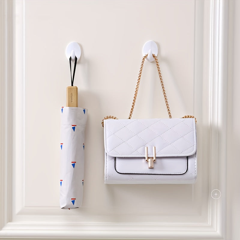 Gancho de pared ovalado de plástico blanco autoadhesivo y sin perforación para almacenamiento