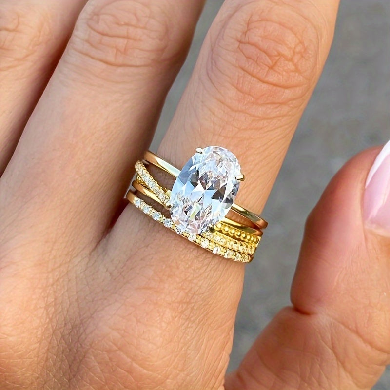 Oddiy va nafis 14K oltin qoplamali S925 kumush uzuk, 1CT, 2CT yoki 3CT oval kesilgan sintetik kubik zirkoni bilan. Kundalik kiyish uchun yoki o'ylangan sovg'a sifatida mukammal.