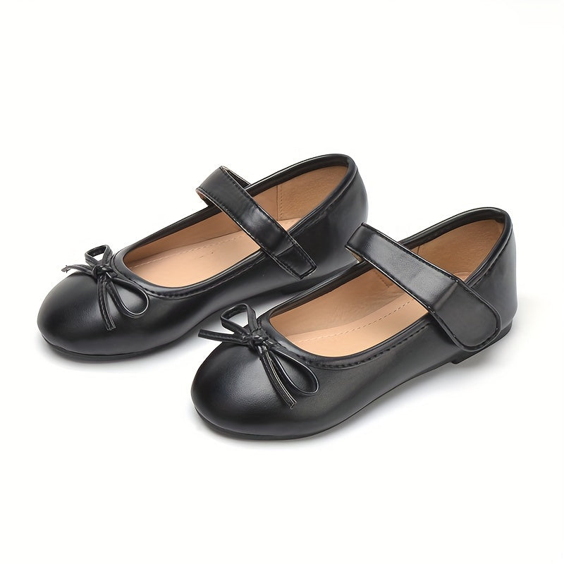 COSYSUSY qizlar uchun Mary Jane poyabzallari, sirpanmaydigan tagliklari va kamon bezaklari bilan, talabalarga qulay tekis poyabzal hisoblanadi.