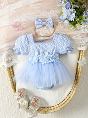 Qizlar uchun nafis gullar bilan tikilgan tutu ko'ylak, puff yenglar va appliqué tafsilotlari bilan. 100% polyester to'qilgan mato, ochiq havoda kiyish uchun mukammal.