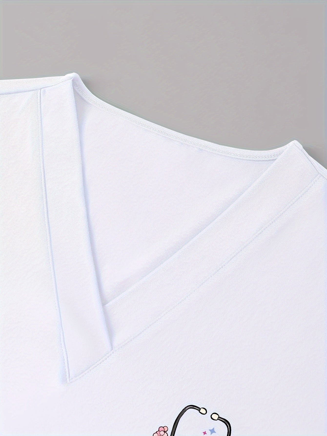 Women's Floral Stethoscope Print Scrub Top with Pockets Short Sleeve Medium Stretch Knit Fabric