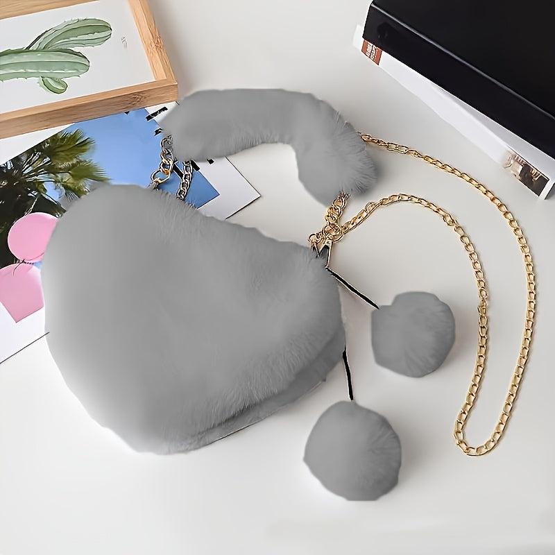 Yengil dizayndagi ajinli ayollar uchun plush yurak shaklidagi yelka sumkasi, ajratiladigan tasma va zip yopilishi bilan. Kundalik sayrlar, xaridlar va uchrashuvlar uchun mukammal. Yorqin pushti va boshqa ranglarda mavjud.