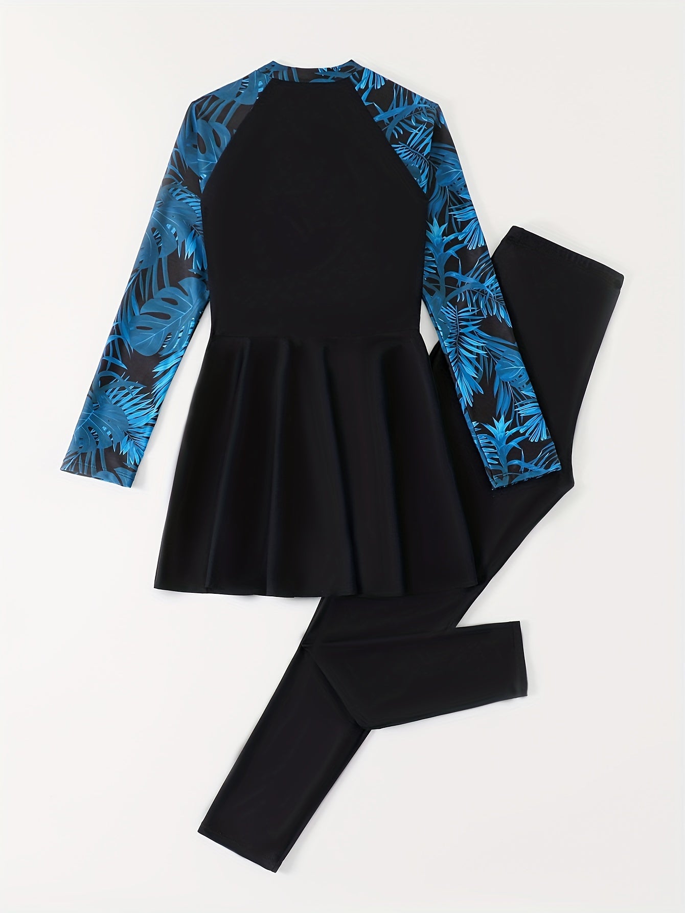 Ayollar uchun yuqori bo'yinli, uzun yengli, gullar bilan bezatilgan suzish kiyimi, fermuar tafsiloti bilan, 82% polyester va 18% elastan to'qimachilik matosidan tayyorlangan. Konservativ to'liq uzunlikdagi yubka ustki qismi va yuqori belga ega.