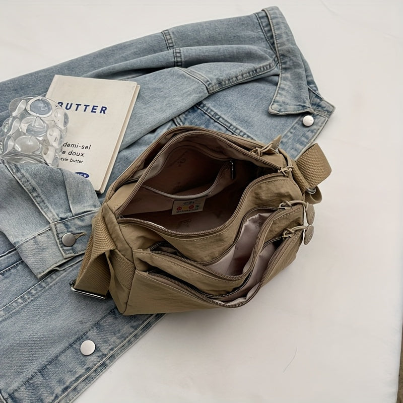 Стильная нейлоновая сумка через плечо для женщин: просторная, легкая, универсального однотонного цвета с застежкой на молнии, идеальна для повседневного использования. Доступна в цветах хаки/черный.