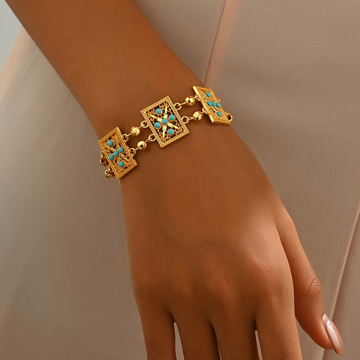 Women’s Gold Plated Alloy Bracelet with Geometric Cut-Out and Blue Cubic Zirconia