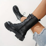 Ayollar uchun sun’iy charm bilan bog‘langan o‘rta balandlikdagi qoq-qoq botinkalar, qattiq poyasi va sirpanishga qarshi tagi bilan