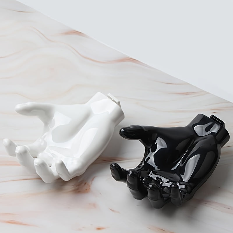 Uyda kalitlar va quloqchinlar uchun kuchli, burgusiz, iz qoldirmaydigan saqlash uchun palma shaklidagi yopishqoq devor osgichi.