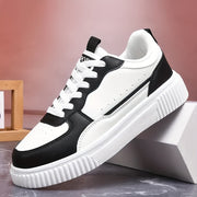 Zapatos de skate casual antideslizantes para hombre, color negro y blanco, suela de EVA, botín bajo, con cordones