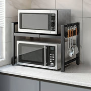 Kengaytiriladigan 2-qavatli metall stol usti pech qismi, qora karbon po'latdan tayyorlangan va oson harakat uchun g'ildiraklar bilan. Mikrotolqinli pech, idish-tovoq va oshxona muhim buyumlarini tartibga solish uchun ideal.