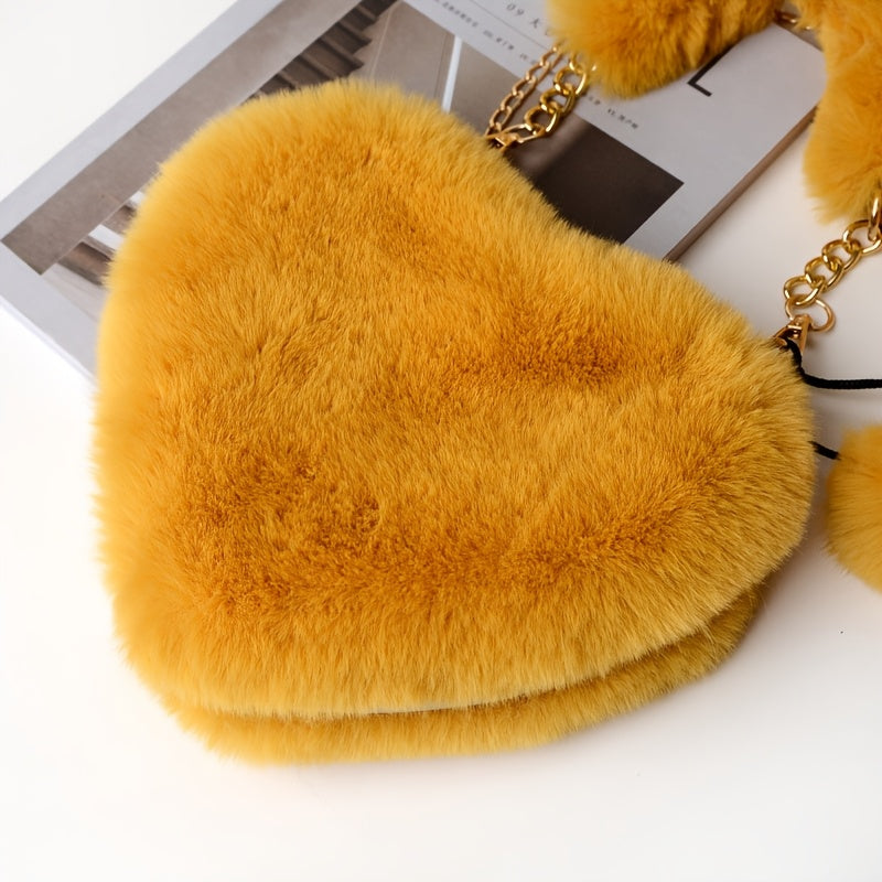 Yengil dizayndagi ajinli ayollar uchun plush yurak shaklidagi yelka sumkasi, ajratiladigan tasma va zip yopilishi bilan. Kundalik sayrlar, xaridlar va uchrashuvlar uchun mukammal. Yorqin pushti va boshqa ranglarda mavjud.