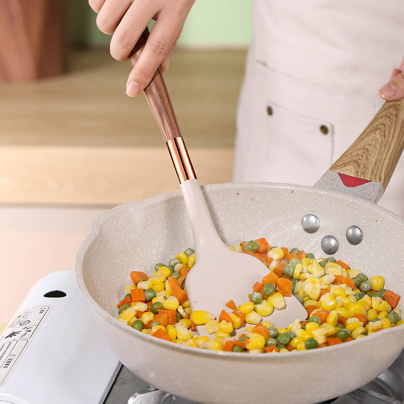 Silicone yog'och to'qimalari spatula, yopishmaydigan qoplama va issiqqa chidamli tutqich bilan, uyda pishirish uchun zarur bo'lgan oshxona asbobi