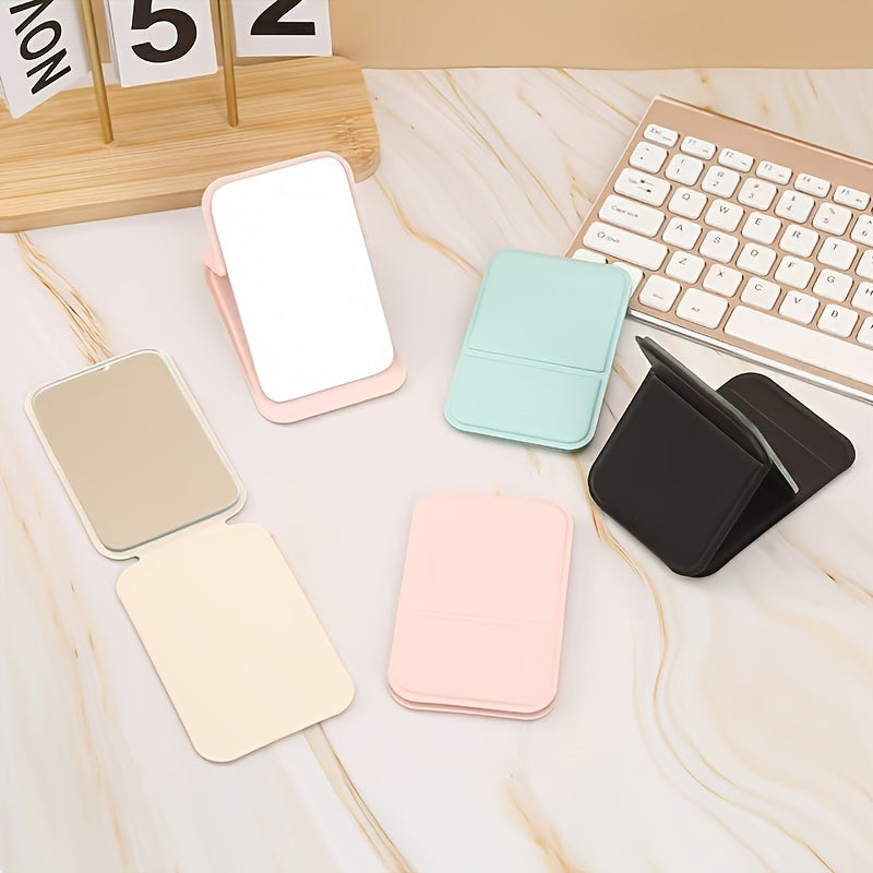 Espejo de maquillaje de mano plegable con espejo compacto de viaje de cuero PU de color sólido