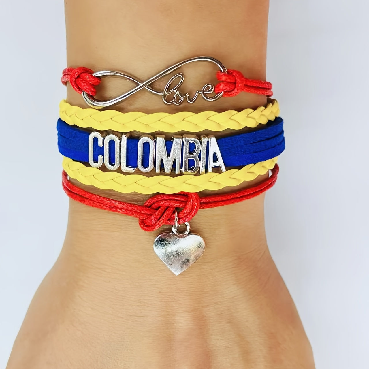 Pulsera elegante de aleación Colombia Love Weaving con diseño de logo Love