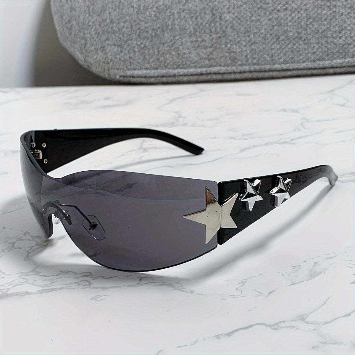 Gafas de moda unisex de gran tamaño con diseño futurista sin marco y decoraciones de estrellas