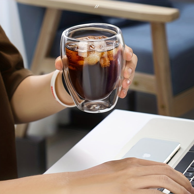 Izolyatsiyalangan espresso stakani, ikki qatlamli shaffof shisha, silikon qopqoq, qulay ushlash va ichish uchun tuxum shaklidagi dizayn. Qahva, sharbat va sut uchun ideal.