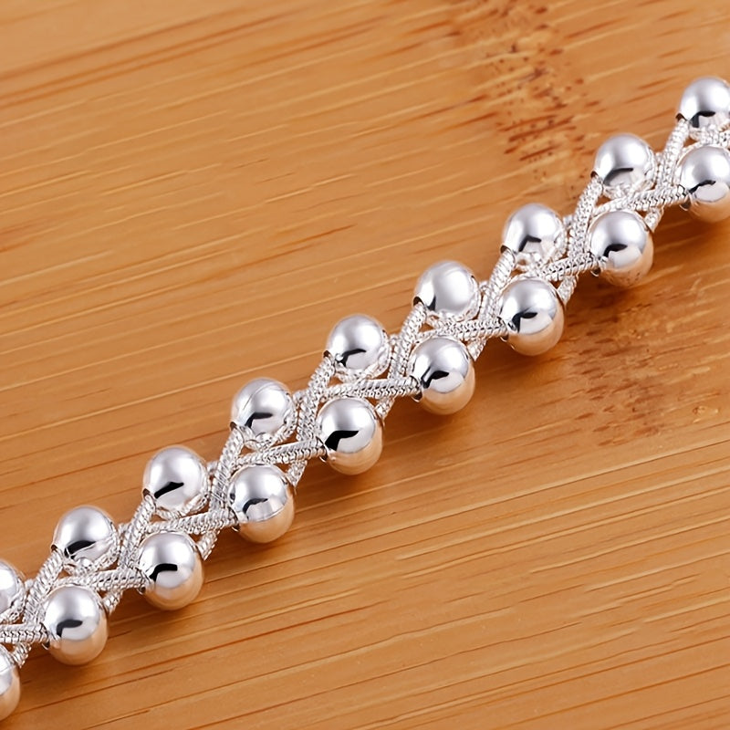 Ayollar uchun sanʼatkorona qoʻlda yasalgan kumush taqinchoq, batafsil toʻqilgan boʻgʻimlar bilan