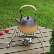 Tashqarida pishirish va BBQ uchun barqarorlashtiruvchi oyoqlarga ega kompakt zanglamaydigan po'latdan yasalgan sayohat grill.