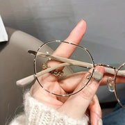 Gafas redondas retro con luz azul para mujeres con montura transparente