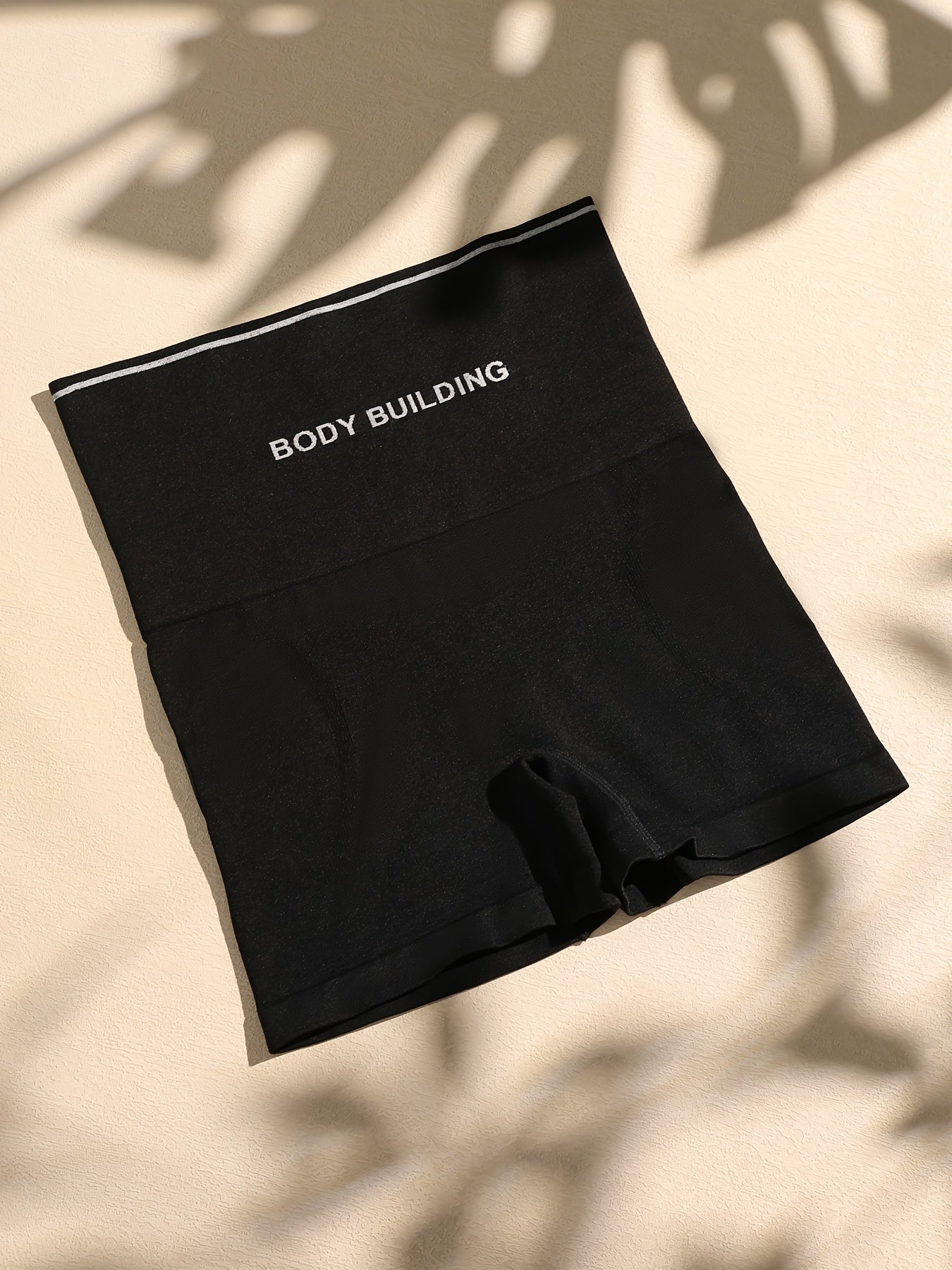 "Женские шорты с высокой талией для сужения бедер однотонного цвета, бесшовные контурные шорты из трикотажной ткани на основе полиамида и эластана с вырезом на спине."