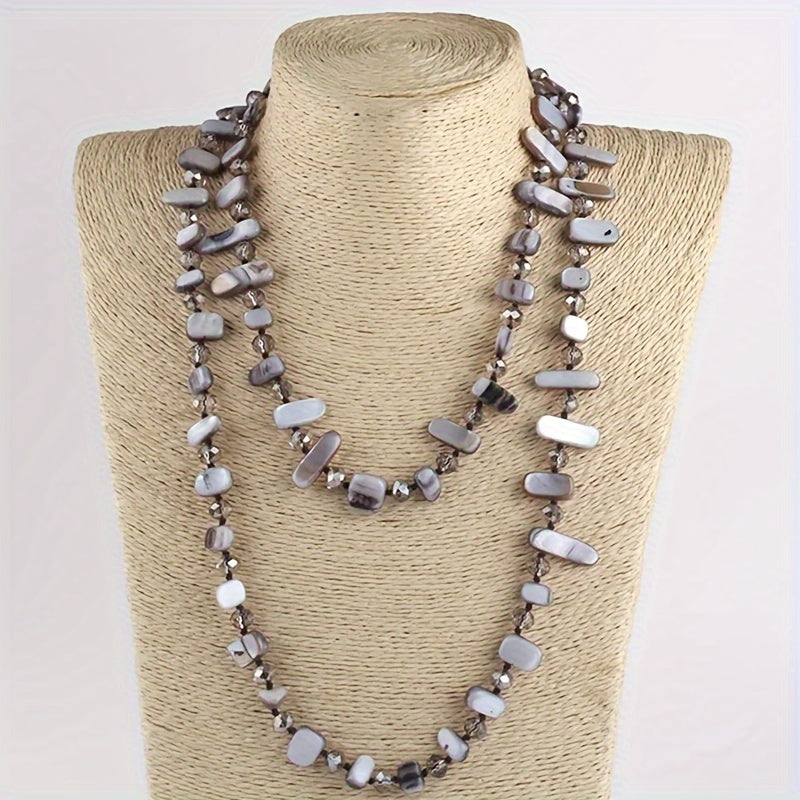 Kamalak kristallari va qobiq marjonlari bilan bezatilgan uzun tugilgan marjon - boho-chic, bohem uslubini sevuvchi ayollar uchun ideal sovg'a.