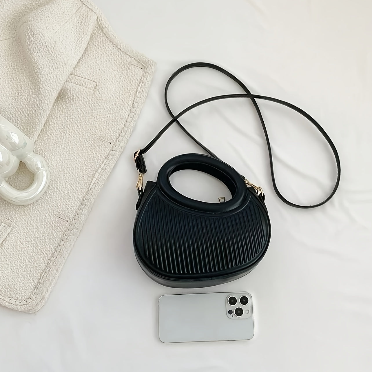 Black Crossbody Bag with Embossed Stripe Pattern and Gold Hardware for Women