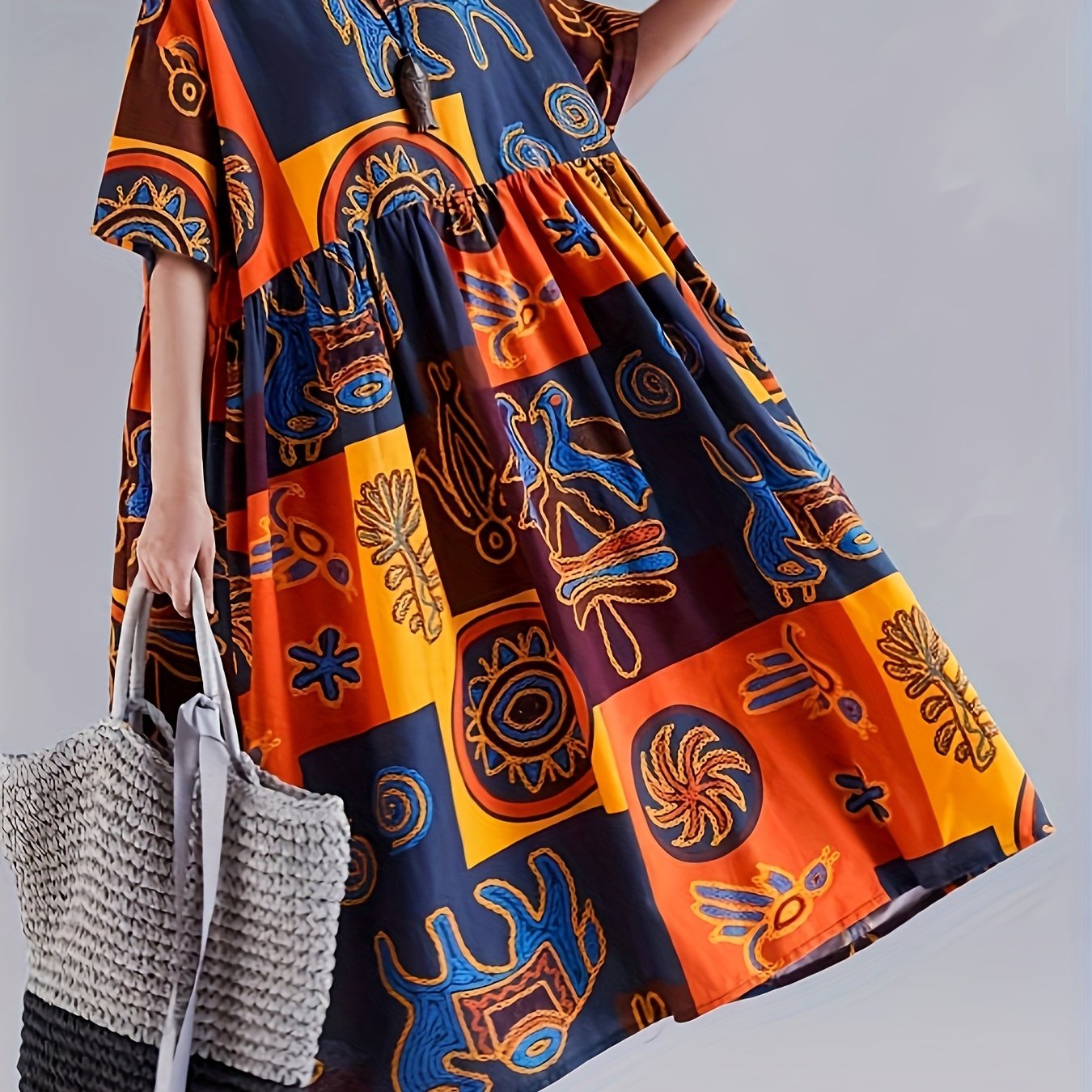 Ayollar uchun rang-barang pop san'at printi maxi ko'ylak, qisqa yenglar, dumaloq bo'yin, cho'ntaklar, erkin kesim, to'qilgan polyester aralashmasidan tayyorlangan. Bir nechta ranglarda jasur geometrik va gullar dizayni mavjud.