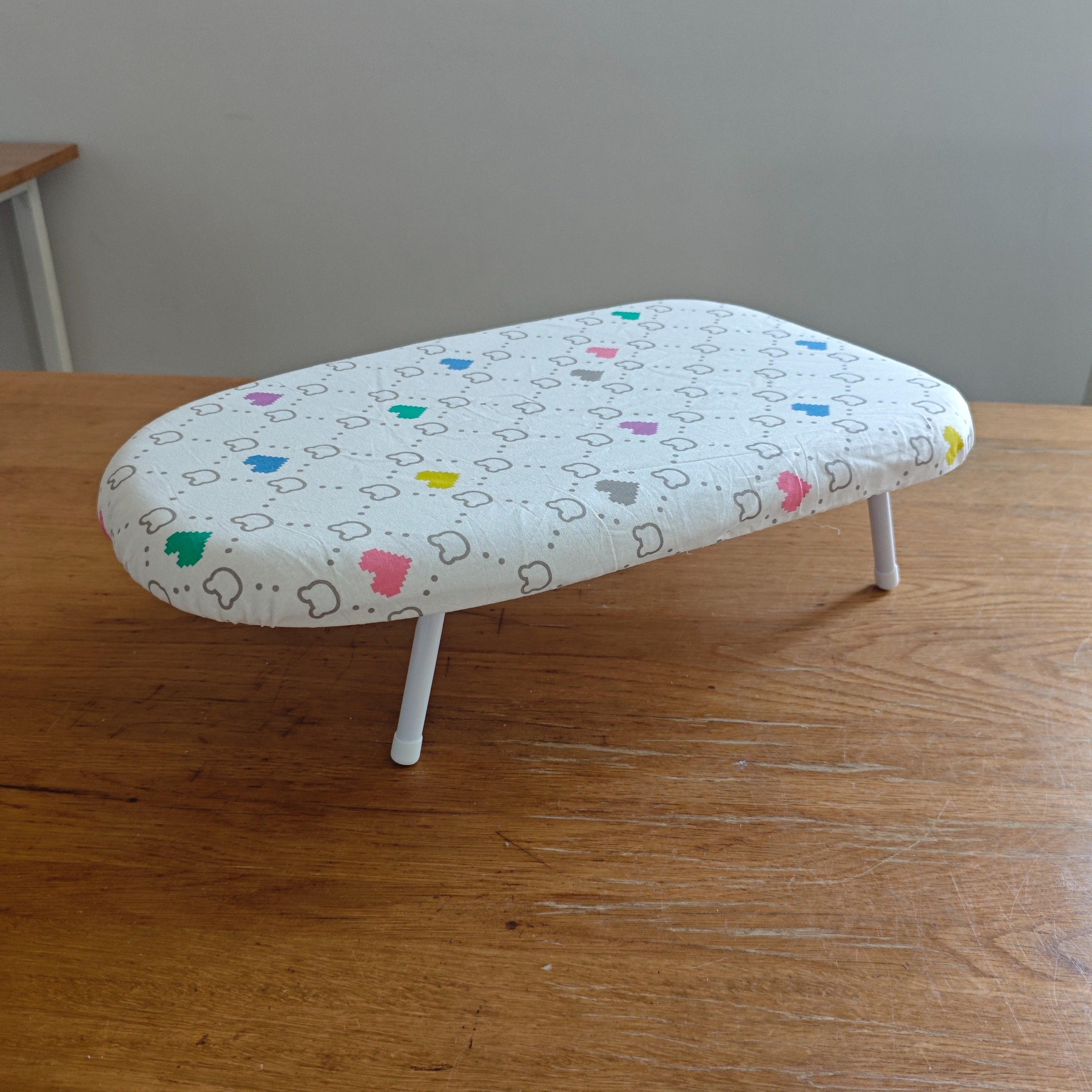 Pink and White Herringbone Foldable Ironing Board with Compact Surface
