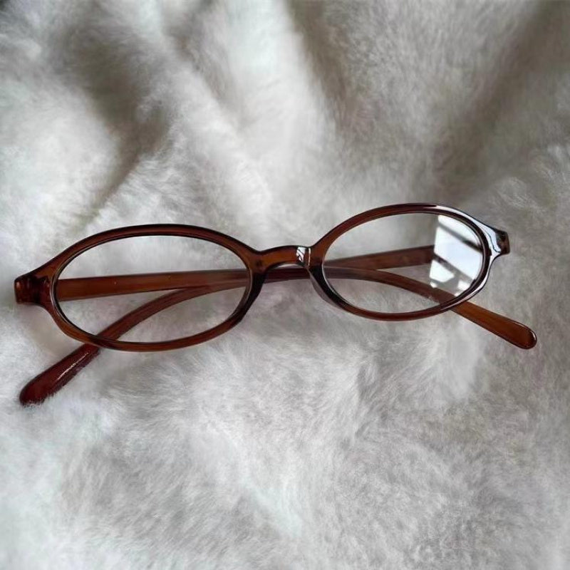 Ayollar uchun qora porloq PC materialidan yasalgan oval ramkali shaffof linzali ko'zoynak, gradient shaffof dizayni bilan, partiyalar, kompyuter ishlatish va har kuni moda uchun mos. Kichik o'lcham va mustahkam, mukammal.