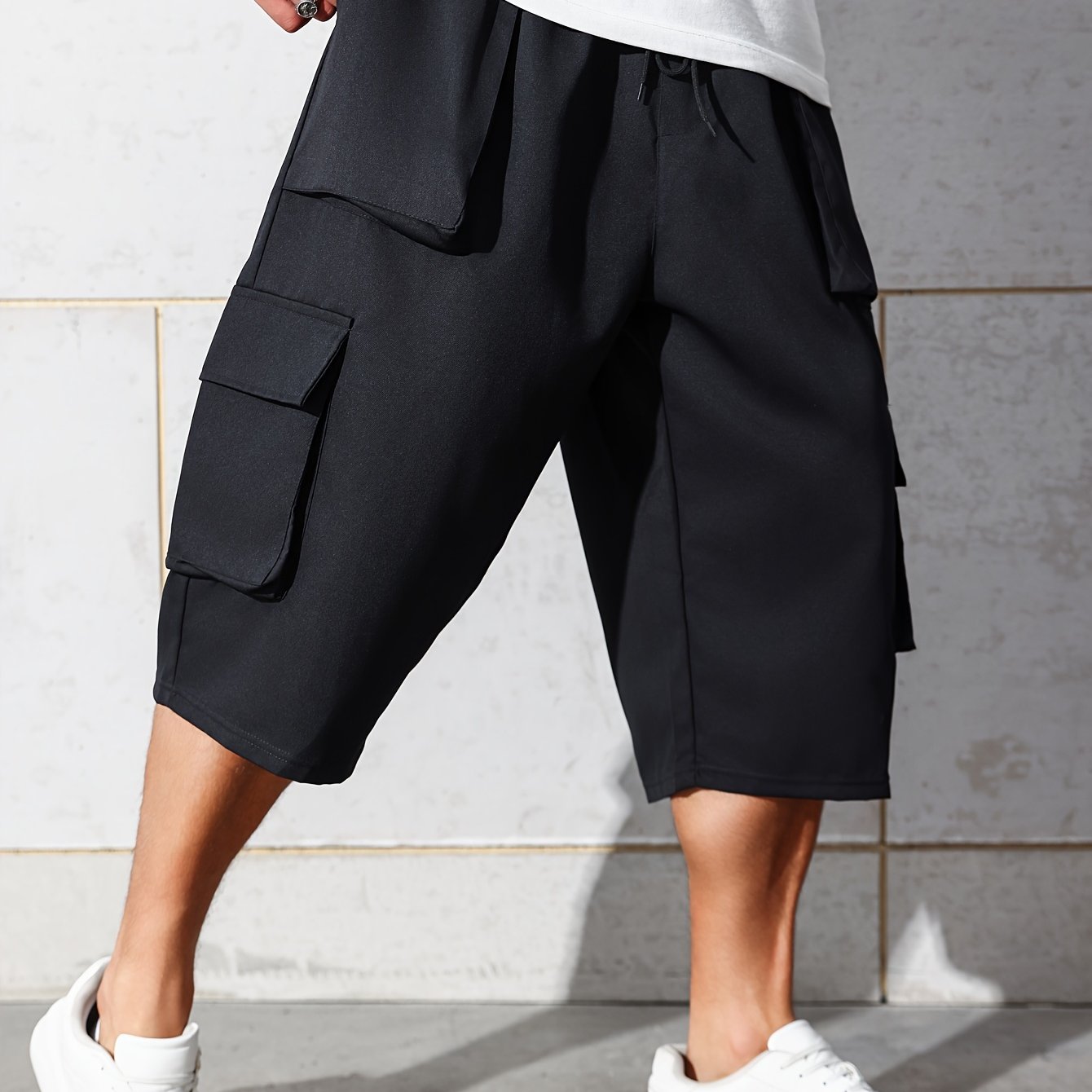 Pantalones cargo de talla grande para hombre de corte relajado hasta la rodilla con múltiples bolsillos y cintura con cordón