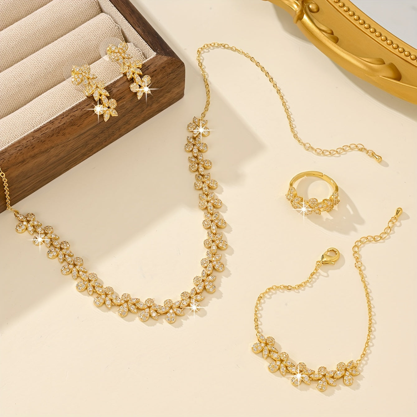 Luxurious Bridal Jewelry Set with Synthetic Zirconia, featuring a Stunning Flower Petal Design in 18K Gold Plating - Includes Necklace, Bracelet, Earrings, and Ring perfect for Wedding and Party Events. Made with Copper Base for utmost quality and