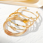 Set de 5 pulseras vintage abiertas para mujer, metálico dorado, con espiral geométrica y nudos
