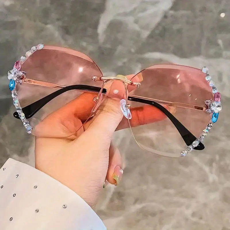 Gafas de ojo de gato oversized sin montura con lentes ombre y diseño unisex