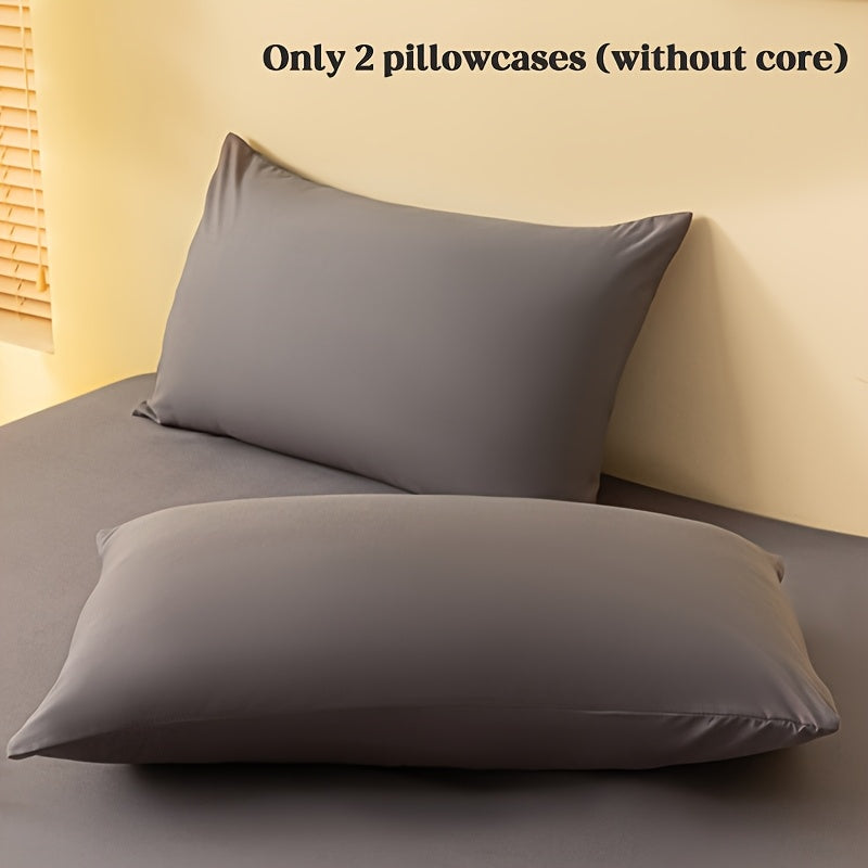 2 ta yostiq qopqog'i, bir rangda, yumshoq va qulay polyester materialidan tayyorlangan, konvert yopilishi bilan, yuvish mashinasida tozalash oson, 90gsm, yotoqxona, mehmonxona yoki mehmonxona to'shagi uchun ideal.