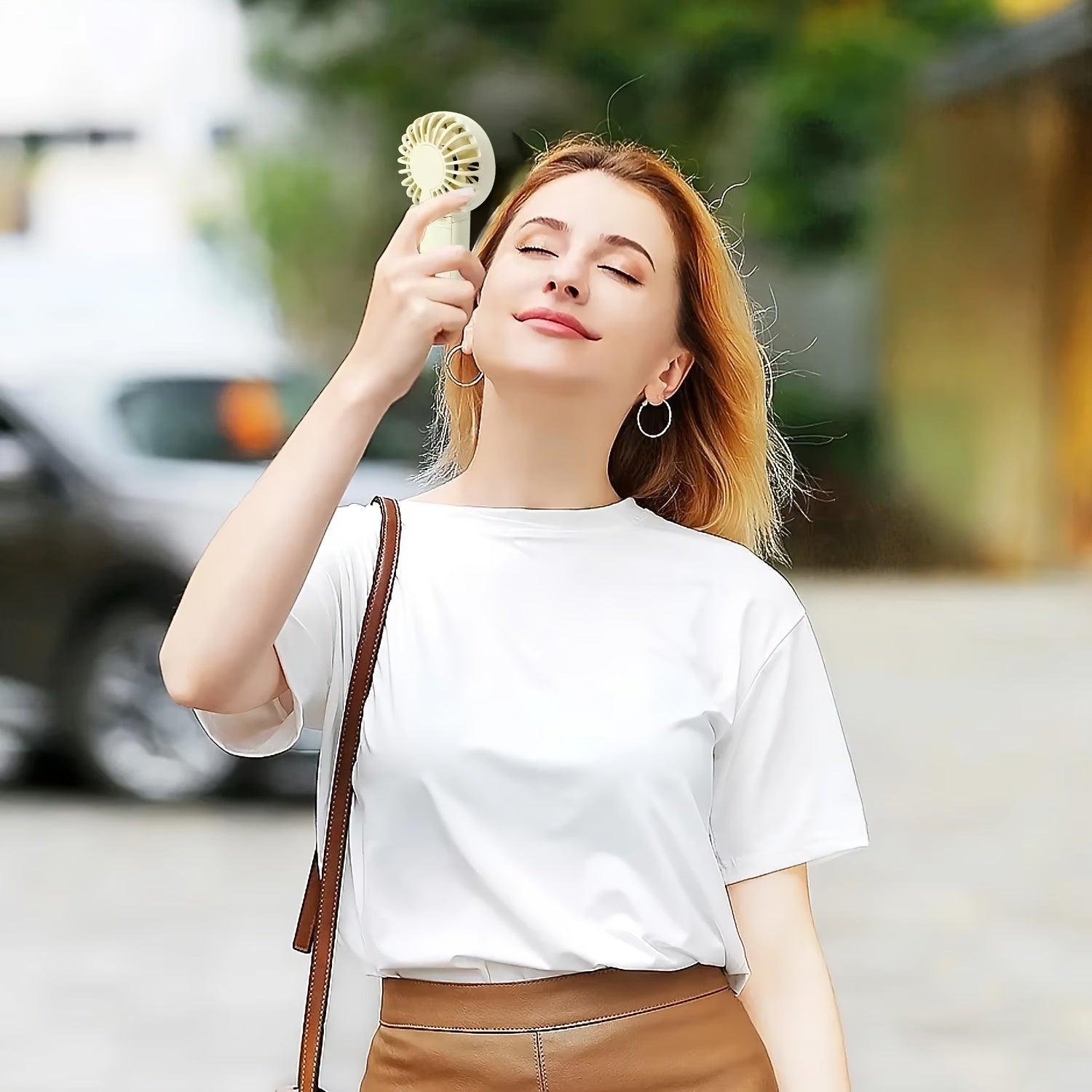 Batareya bilan ta'minlanmagan portativ qo‘l fan, yengil va sozlanadigan, qulay va ijodiy dizayn, cho'ntak o'lchamida va chiroyli.