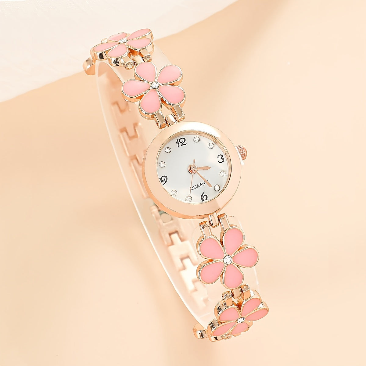 Reloj de cuarzo para mujer con detalles de rhinestone y banda de aleación de zinc con patrón de flor de ciruelo