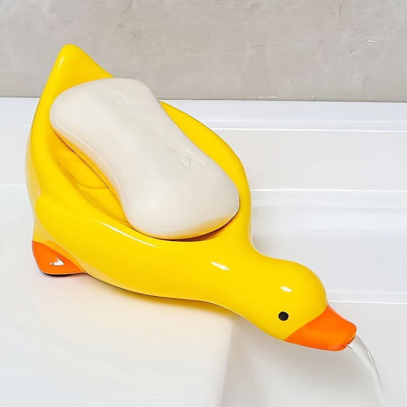 Jabonera con forma de pato con drenaje automático y diseño de cascada para una limpieza fácil