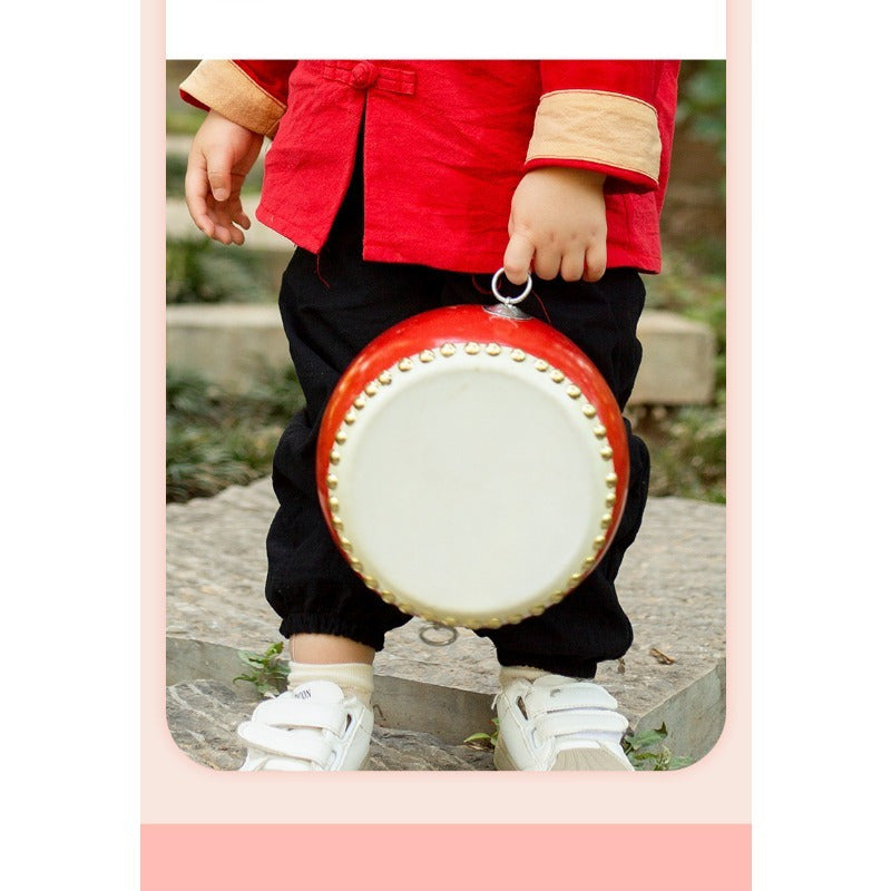 Red Cowhide Drum with White Rivets, Plastic Body, Wooden Drumsticks