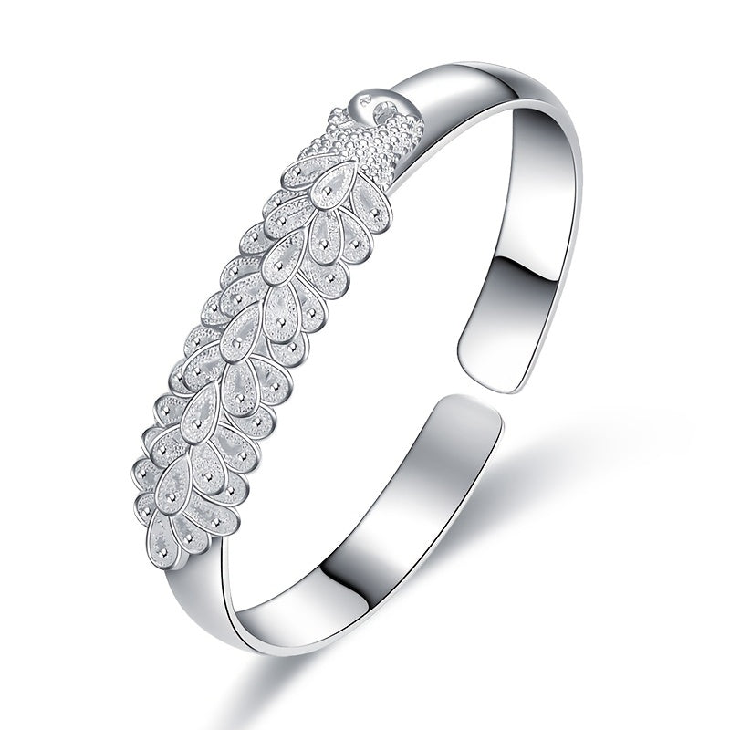 Women’s Ethnic-Inspired Bracelet with Peacock Feather Silk Opening and Phoenix Design