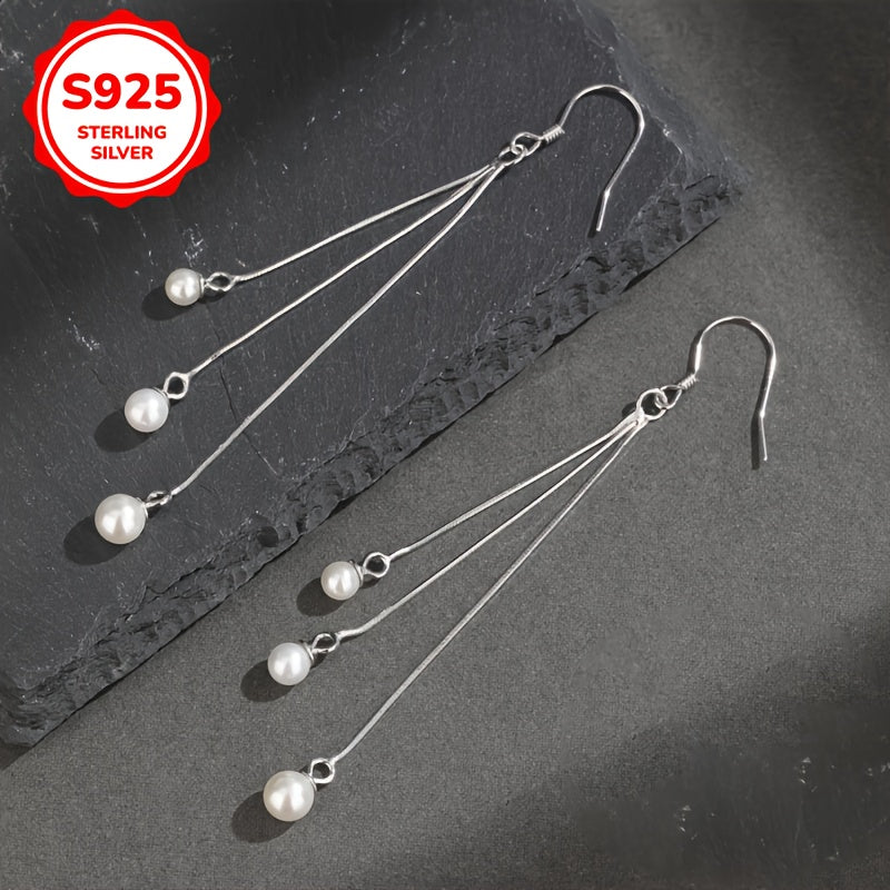 Silliq va zamonaviy, bu S925 Sterling Silver sirg'alar uzun tassellarga va shirin suv marvaridlariga ega. Gippoallergen va 2G og'irlikda yengil, ular ayollar uchun har kuni kiyish uchun ideal va ajoyib Onalar kuni sovg'asi bo'ladi.