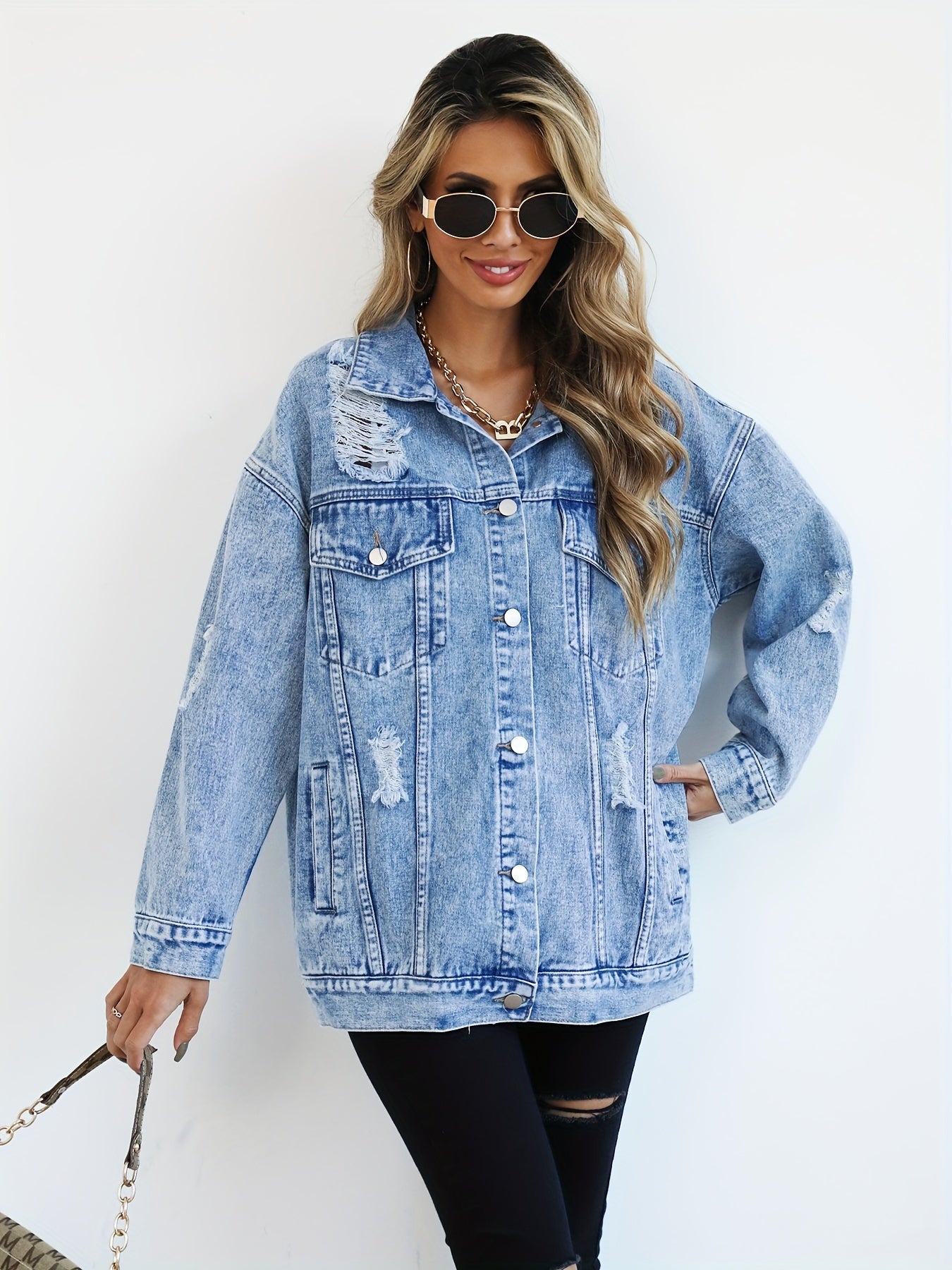 Women’s Light Blue Denim Jacket with Ripped Detailing and Long Sleeves