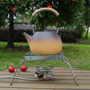 Sayohat va tashqarida ovqat pishirish uchun yig'iladigan oyoqlarga ega portativ zanglamaydigan po'latdan yasalgan gril