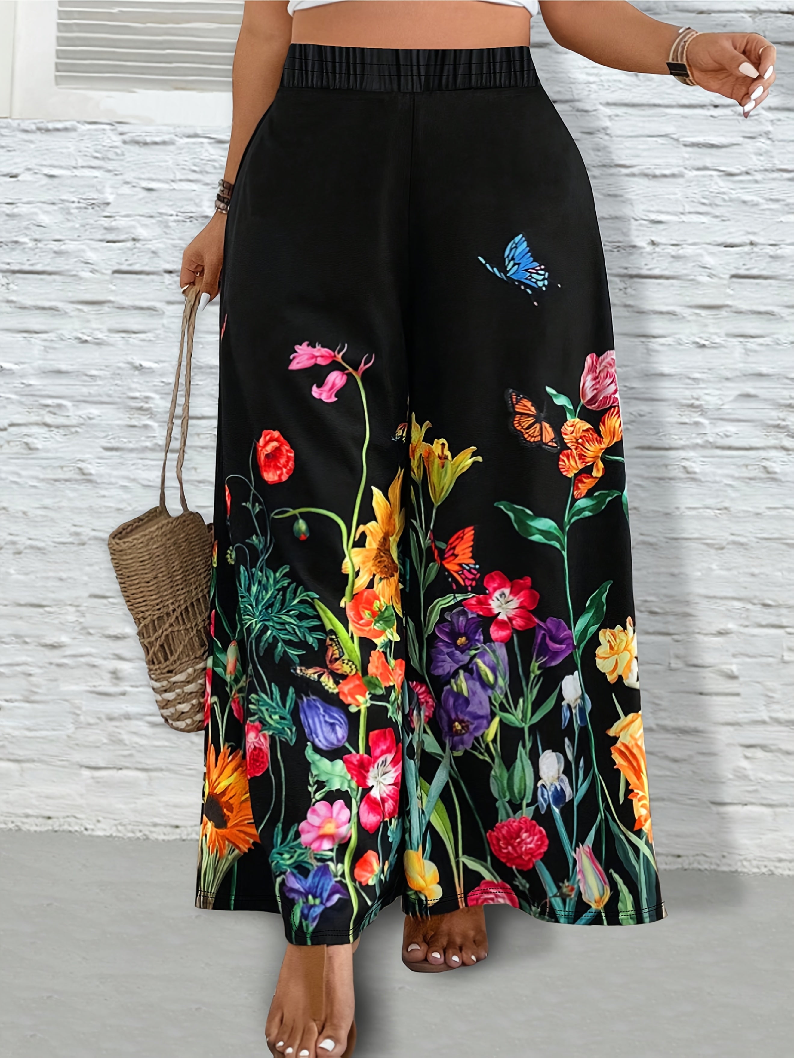 Pantalones de mujer de talla grande con pierna ancha y estampado floral negro vibrante, casual
