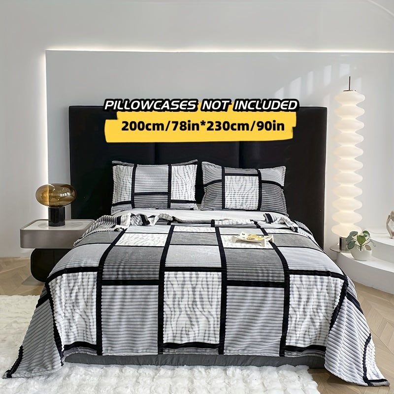 Yumshoq va qulay plush ko'rpa, plaid naqshiga ega, sayohat, divan, yotoq va uy bezatish uchun mukammal.