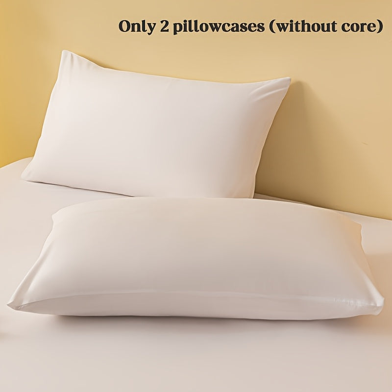 2 ta yostiq qopqog'i, bir rangda, yumshoq va qulay polyester materialidan tayyorlangan, konvert yopilishi bilan, yuvish mashinasida tozalash oson, 90gsm, yotoqxona, mehmonxona yoki mehmonxona to'shagi uchun ideal.