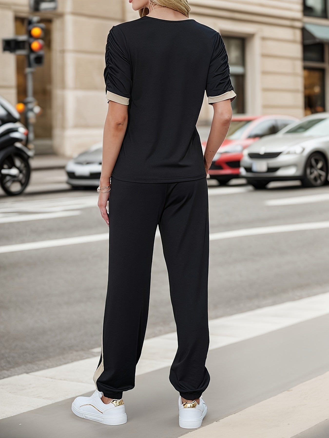 Conjunto de dos piezas con bloques de color para mujer con camiseta de manga abullonada y pantalones, otoño e invierno, punto de poliéster