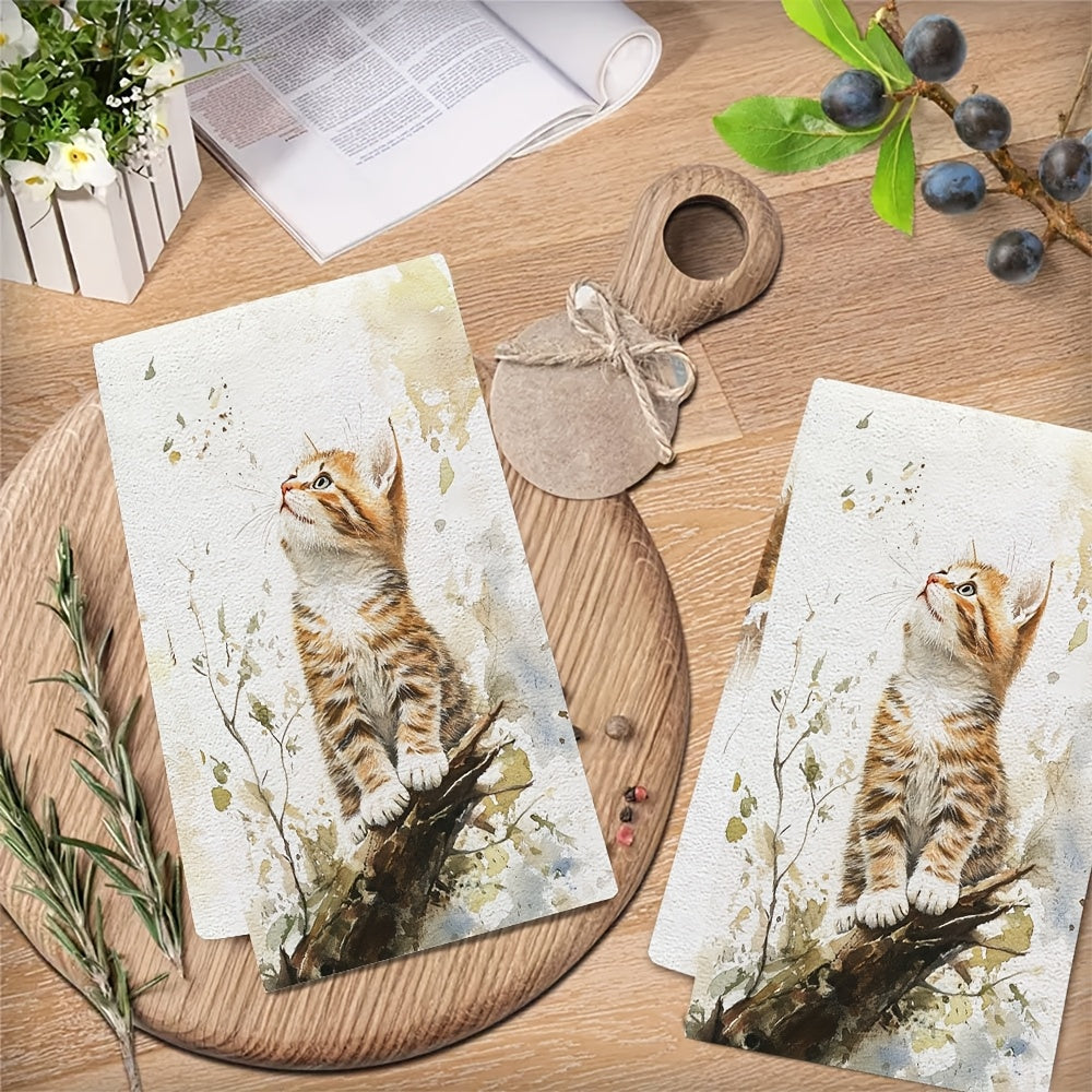 2 ta Ultra Soft oshxona sochiqlari to'plami, Endearing Orange Kitten dizayni bilan. Bu sochiqlar juda yaxshi yutuvchi va tez quriydi, oshxonada foydalanish uchun ideal. Ular mashinada yuviladi va pishirish va pishirish uchun mos. Har bir sochiq o'lchami