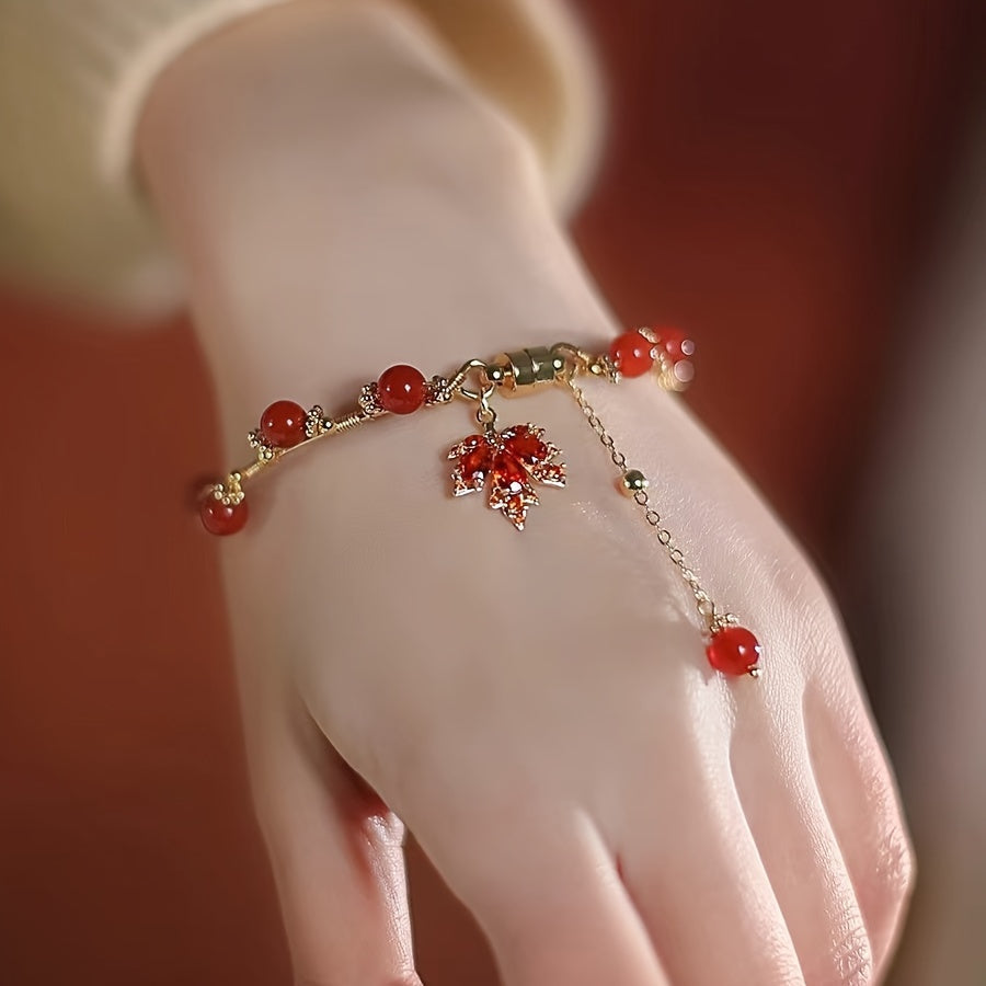 Vintage nafis uslubdagi bilaguzuk, nozik qizil xarang yaproqlari bilan pendanti, mis zargarlikdan tayyorlangan. Ushbu omadli qo'l ipi ayollar uchun mos keladi.