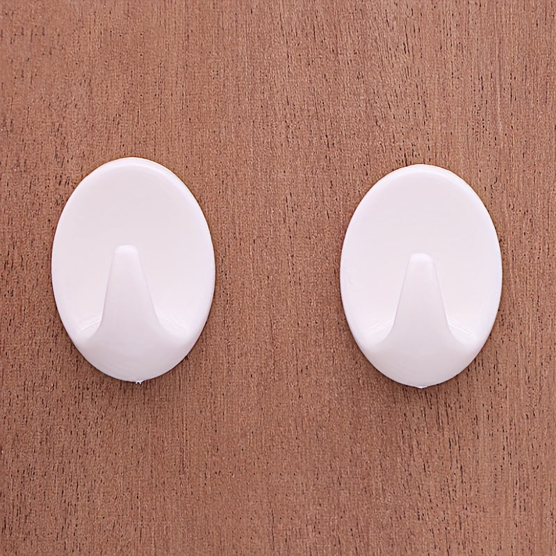 Gancho de pared ovalado de plástico blanco autoadhesivo y sin perforación para almacenamiento
